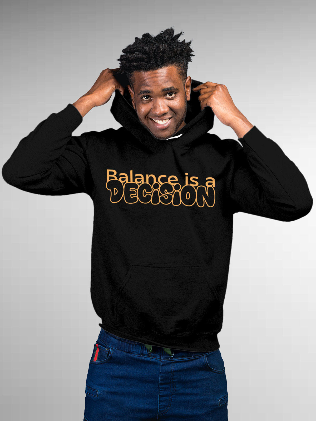 Model wearing Men's Black Hoodie Sweatshirt with 'Balance Is A Decision' design, offering effortless style and premium comfort