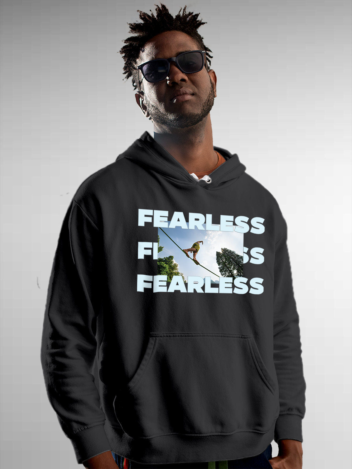 Model wearing Men's Dark Grey Hoodie Sweatshirt with 'Fearless' design, offering effortless style and premium comfort