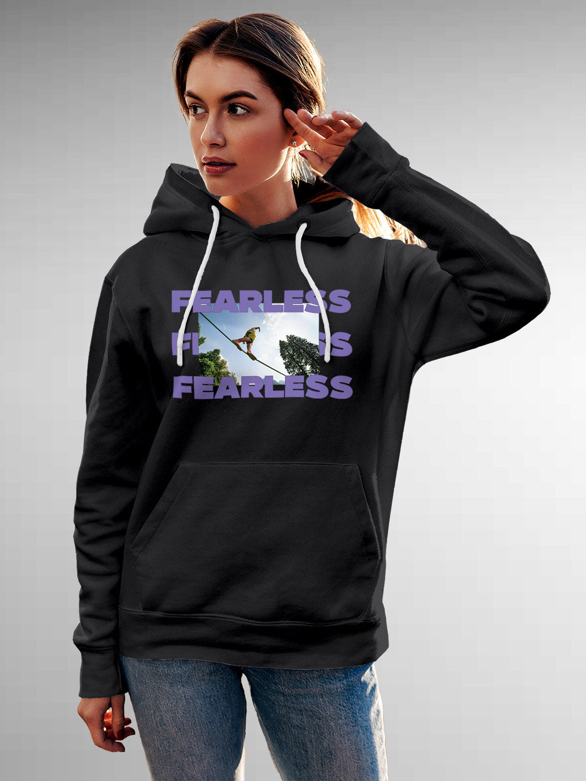 Model wearing Women's Dark Grey Hoodie Sweatshirt with 'Fearless' design, offering effortless style and premium comfort