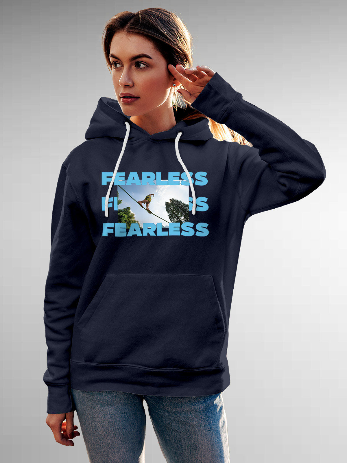Model wearing Women's Navy Blue Hoodie Sweatshirt with 'Fearless' design, offering effortless style and premium comfort