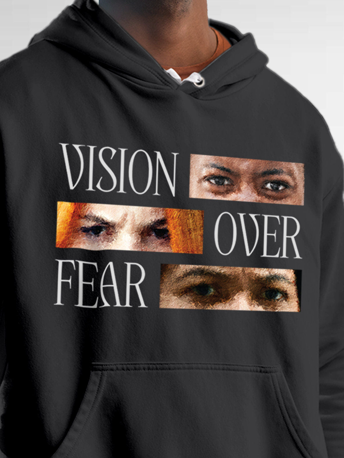 Close up of 'Vision Over Fear' design on Men's Dark Grey Hoodie Sweatshirt, highlighting intricate details and vibrant print.