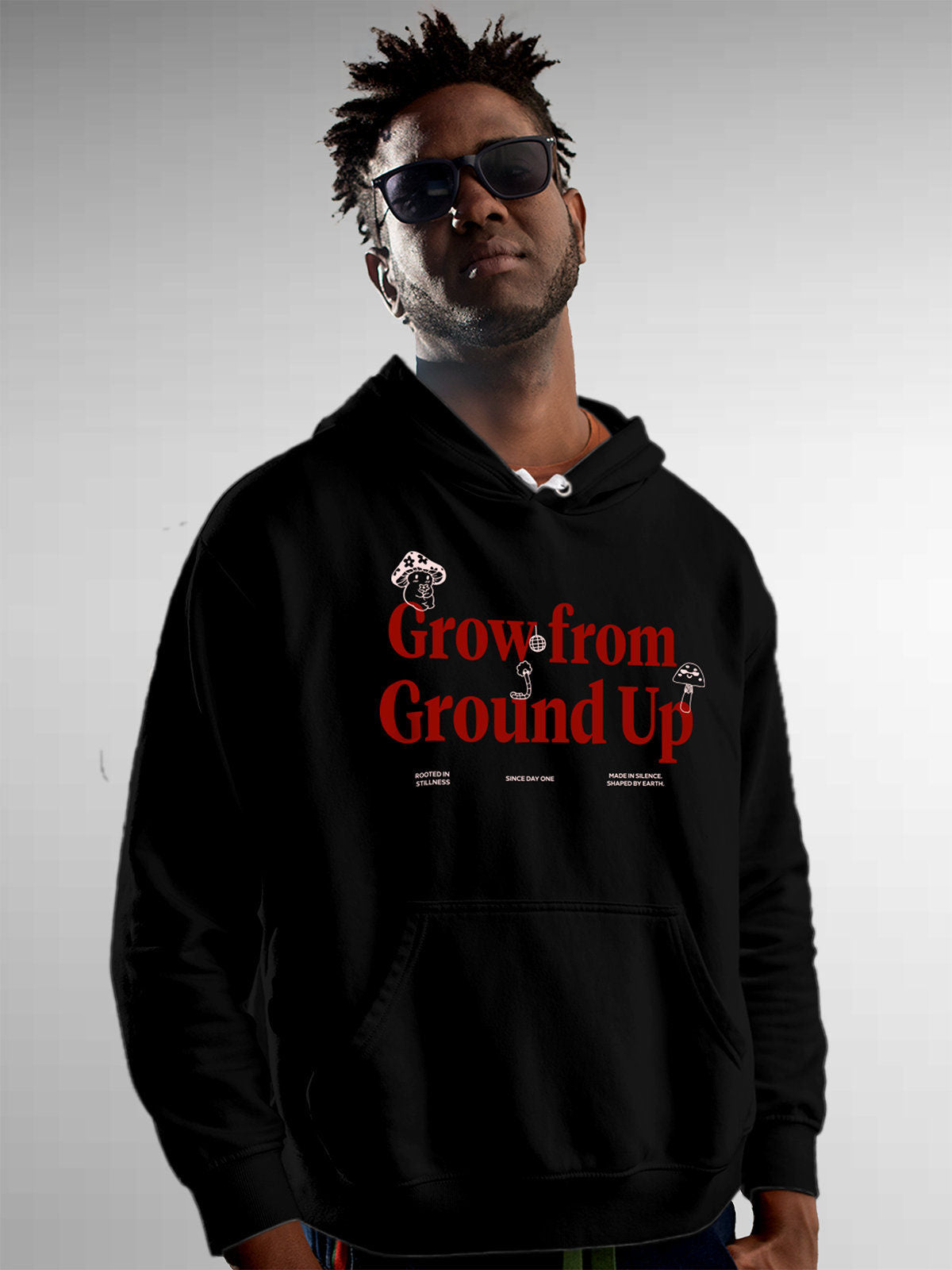 Model wearing Men's Black Hoodie Sweatshirt with 'Grow From Ground Up' design, offering effortless style and premium comfort
