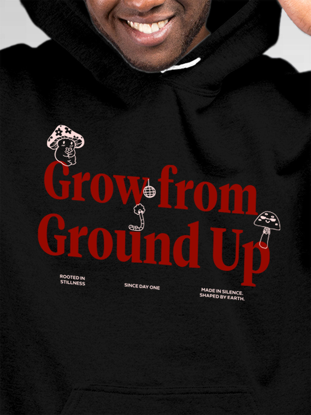 Close up of 'Grow From Ground Up' design on Men's Black Hoodie Sweatshirt, highlighting intricate details and vibrant print.