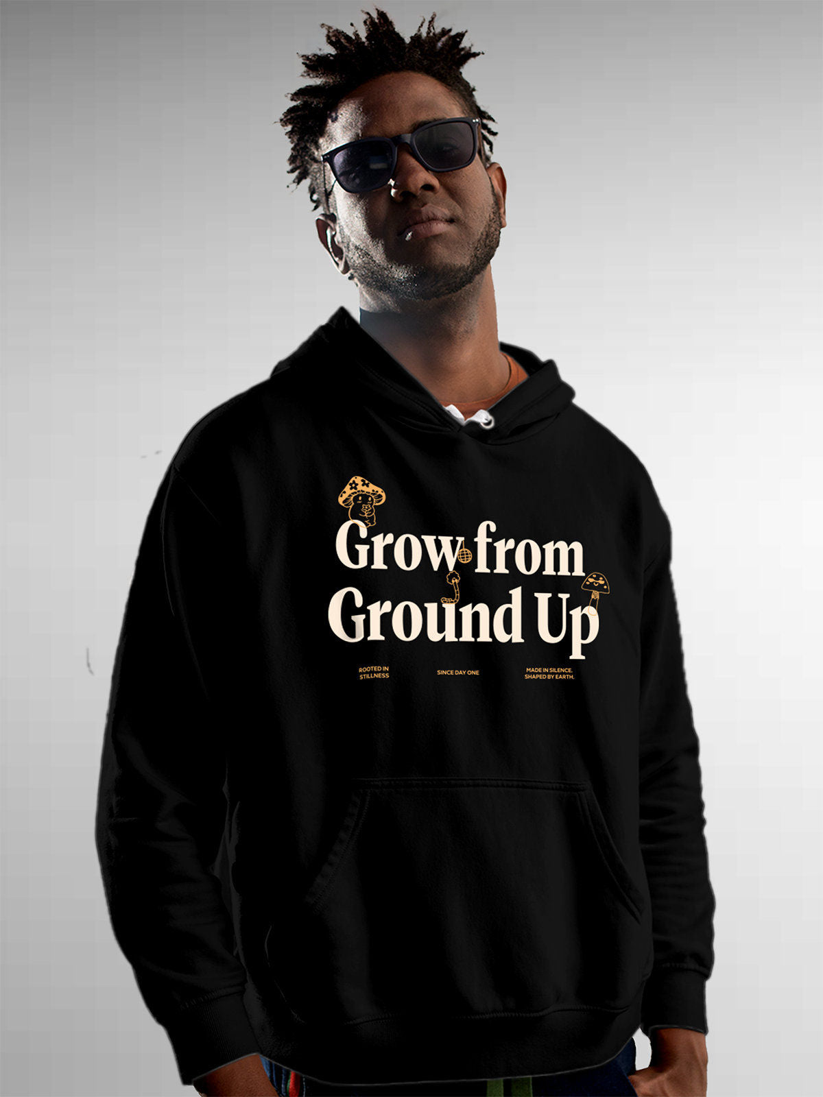 Model wearing Men's Black Hoodie Sweatshirt with 'Grow From Ground Up' design, offering effortless style and premium comfort