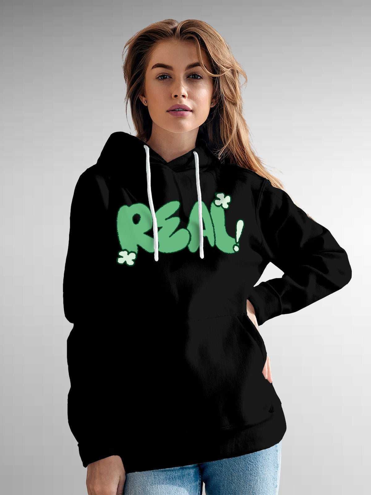 Model wearing Women's Black Hoodie Sweatshirt with 'Real' design, offering effortless style and premium comfort