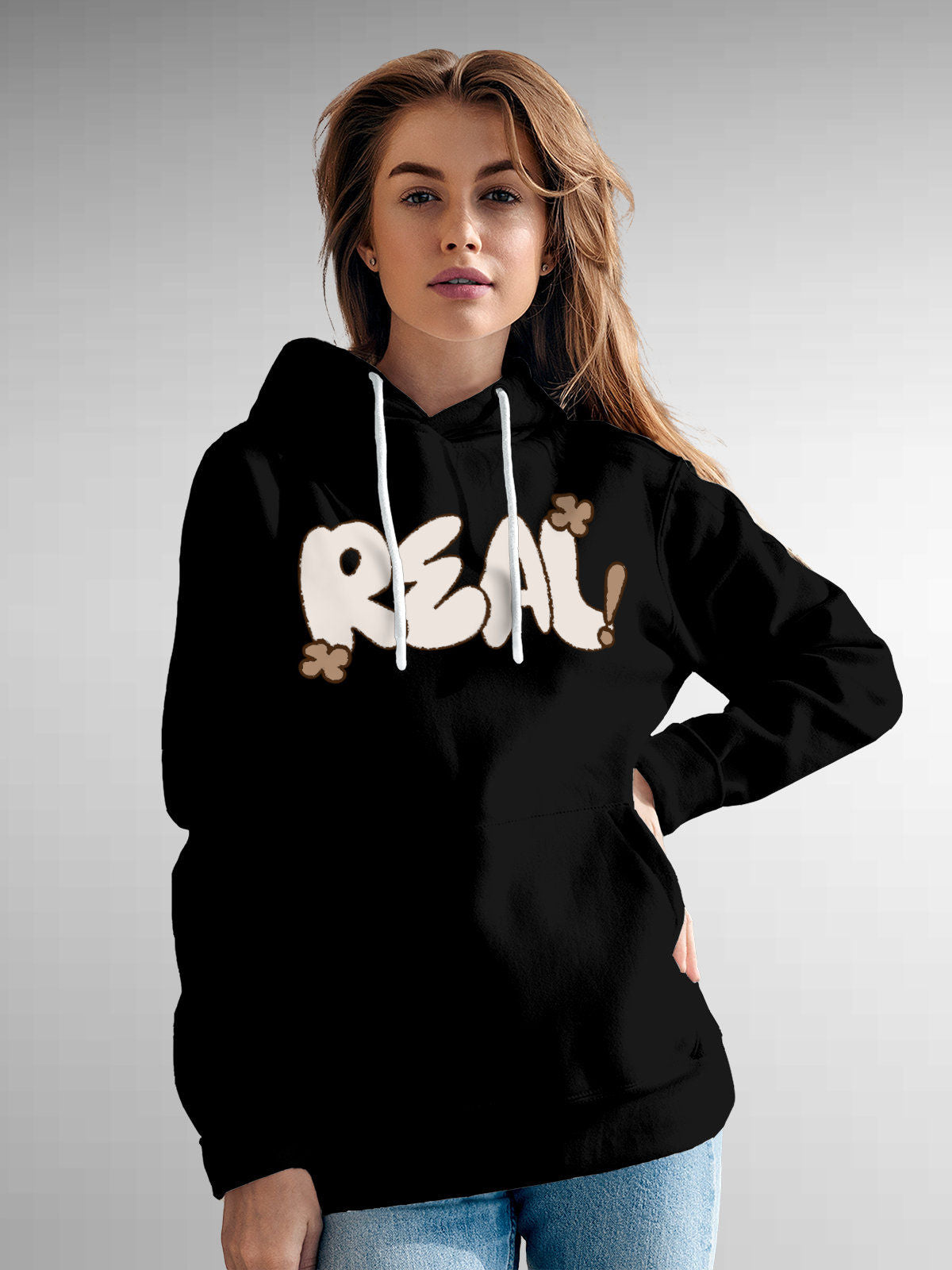 Model wearing Women's Black Hoodie Sweatshirt with 'Real' design, offering effortless style and premium comfort