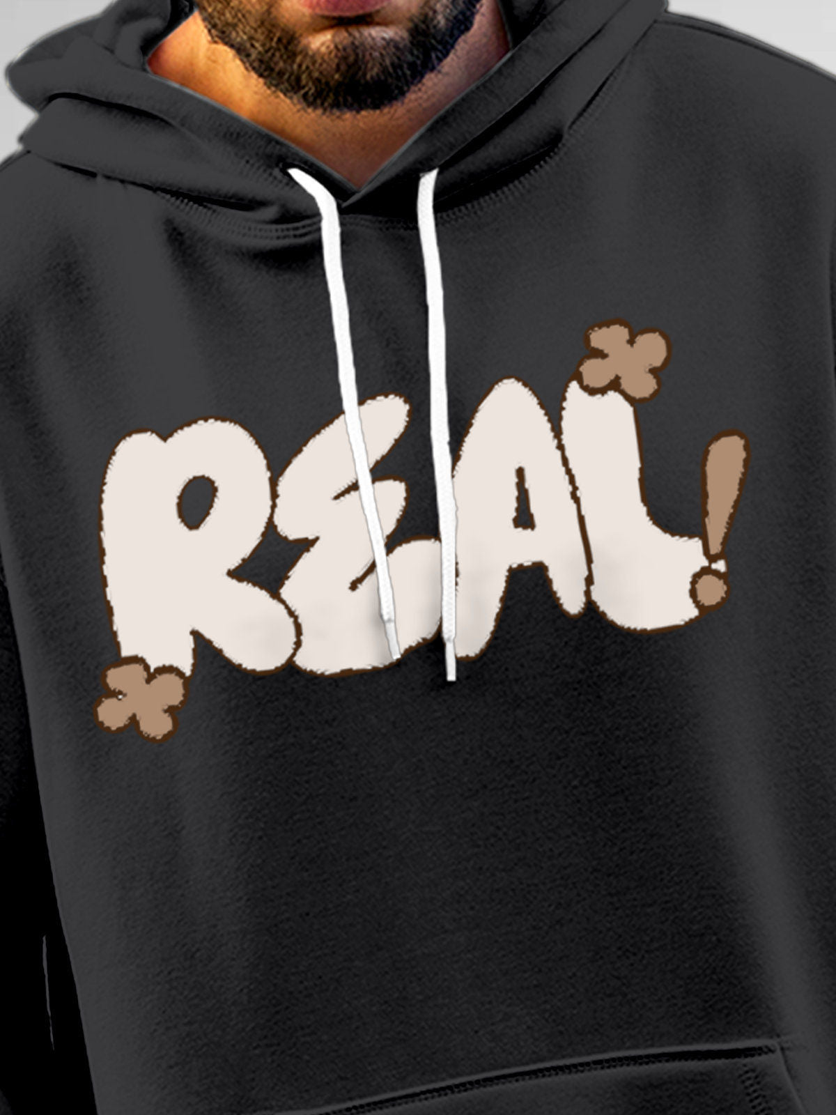 Close up of 'Real' design on Men's Dark Grey Hoodie Sweatshirt, highlighting intricate details and vibrant print.