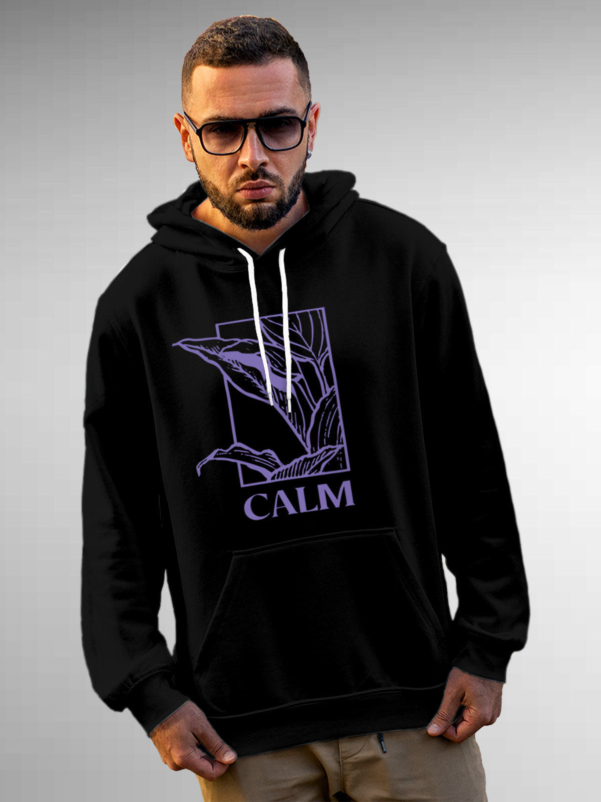 Model wearing Men's Black Hoodie Sweatshirt with 'Calm' design, offering effortless style and premium comfort