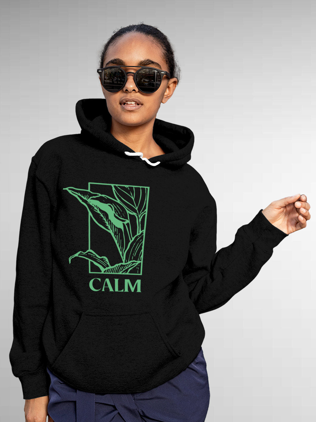Model wearing Women's Black Hoodie Sweatshirt with 'Calm' design, offering effortless style and premium comfort