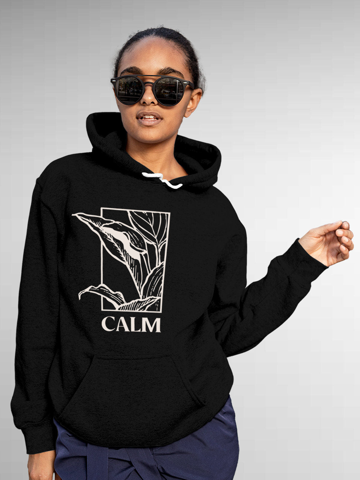 Model wearing Women's Black Hoodie Sweatshirt with 'Calm' design, offering effortless style and premium comfort