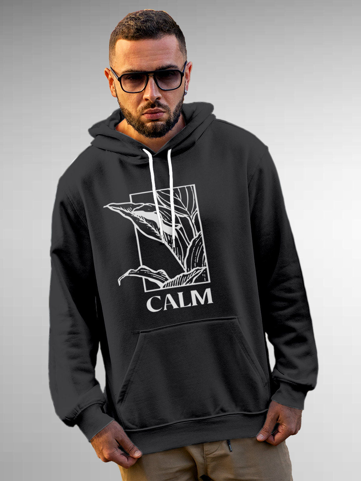 Model wearing Men's Dark Grey Hoodie Sweatshirt with 'Calm' design, offering effortless style and premium comfort