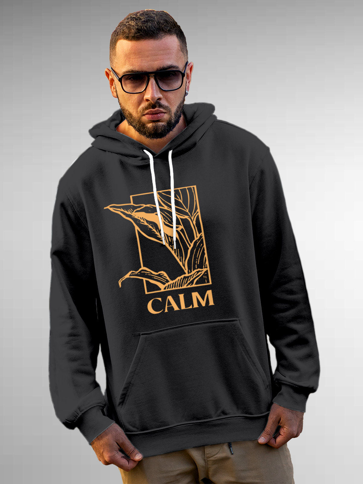 Model wearing Men's Dark Grey Hoodie Sweatshirt with 'Calm' design, offering effortless style and premium comfort