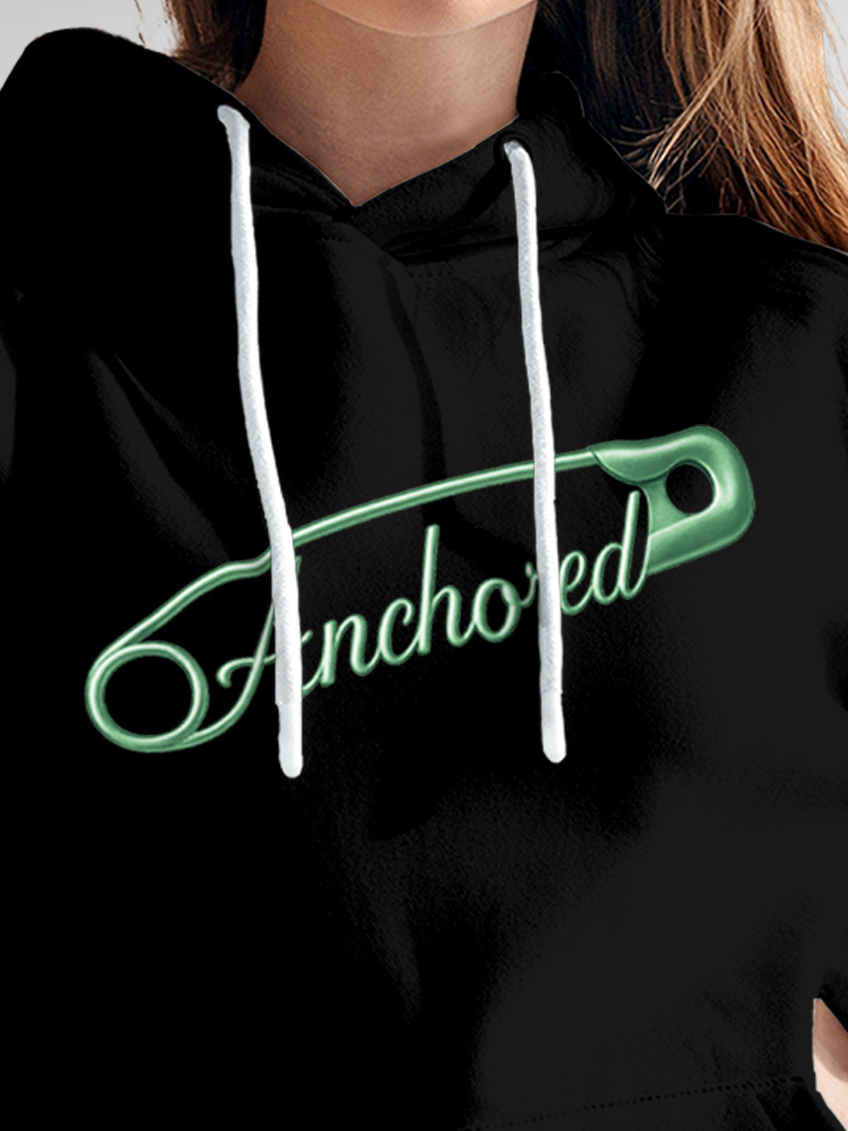 Close up of 'Anchored' design on Women's Black Hoodie Sweatshirt, highlighting intricate details and vibrant print.