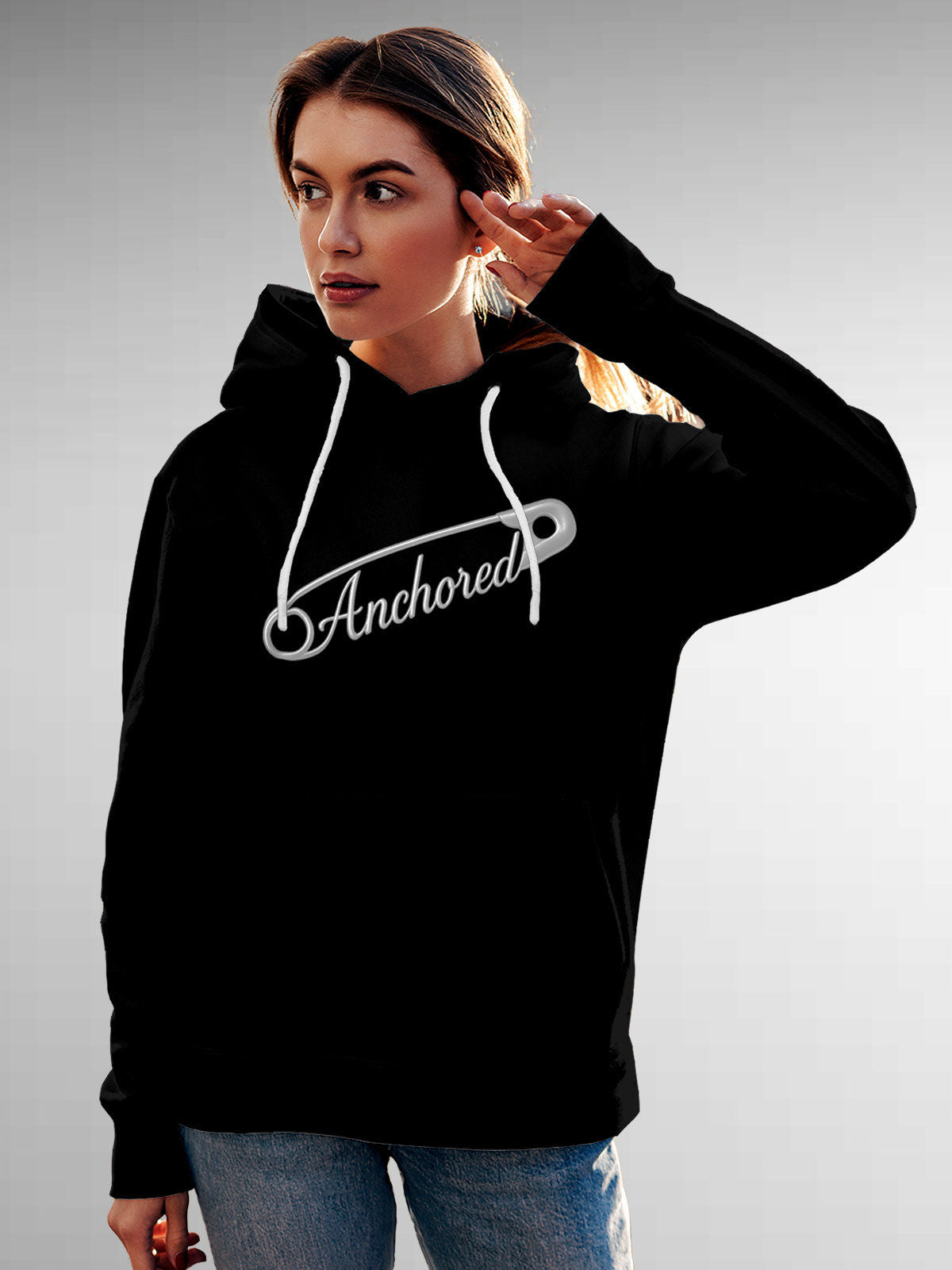 Model wearing Women's Black Hoodie Sweatshirt with 'Anchored' design, offering effortless style and premium comfort