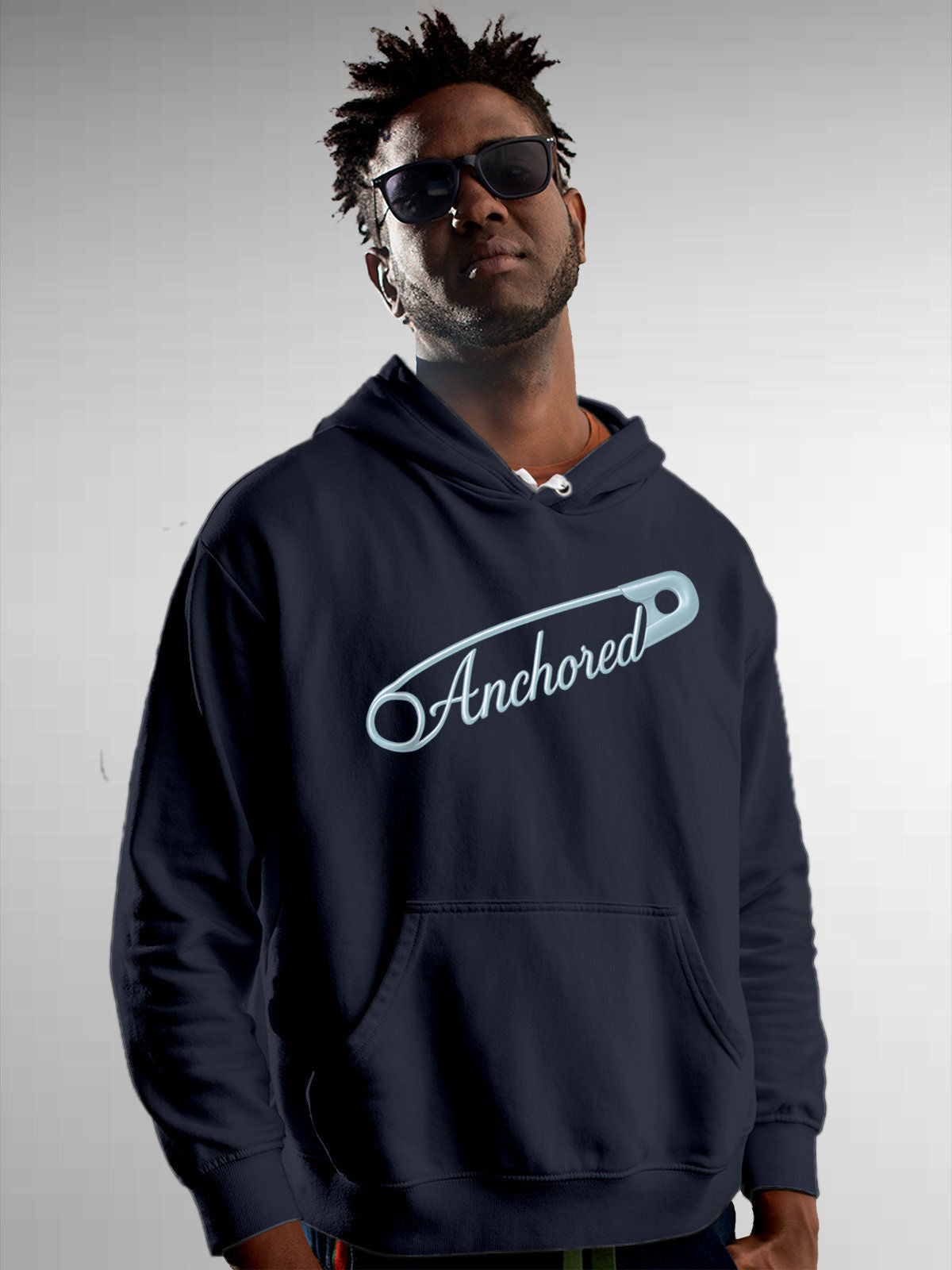 Model wearing Men's Navy Blue Hoodie Sweatshirt with 'Anchored' design, offering effortless style and premium comfort