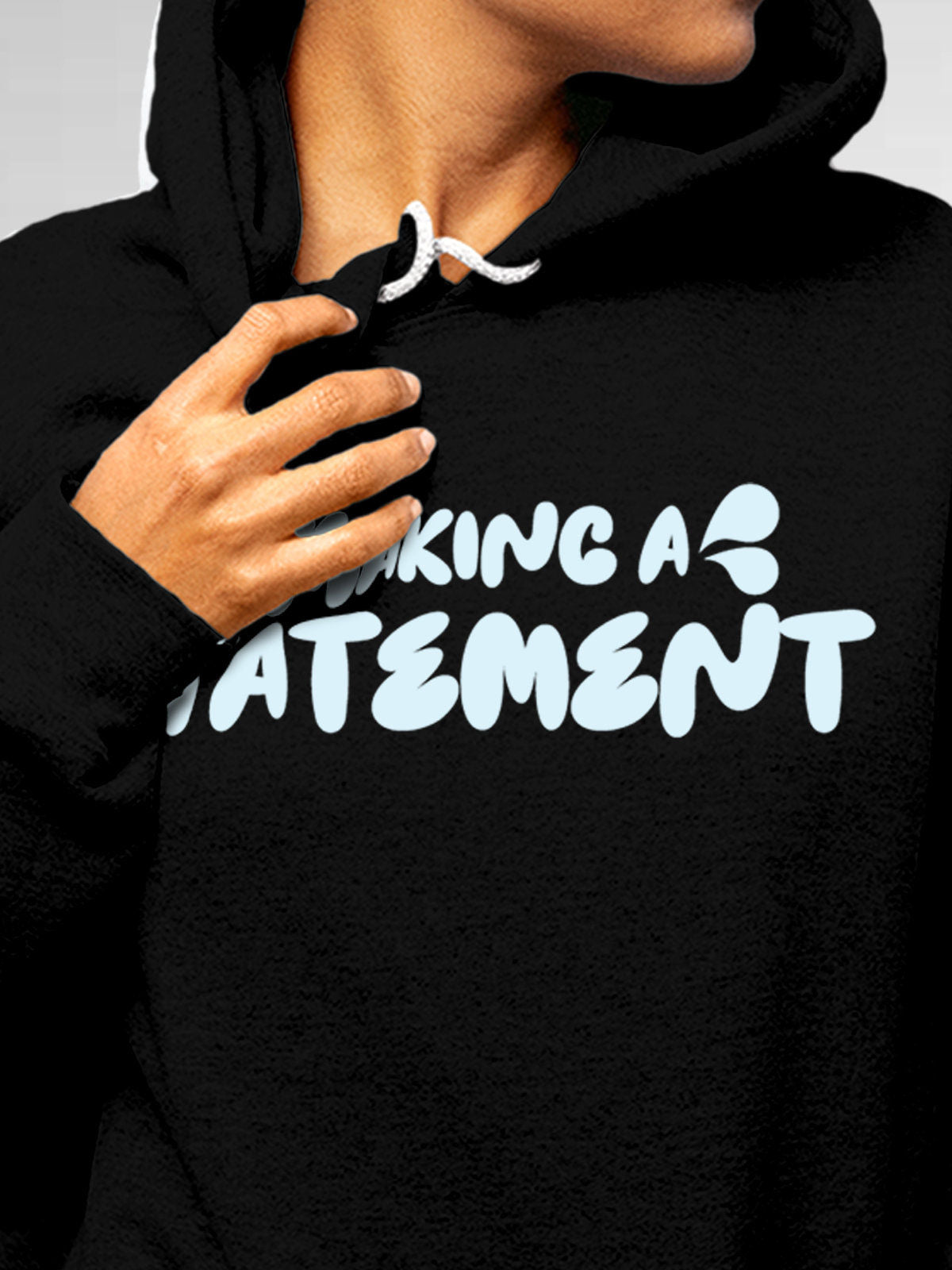Close up of 'Making A Statement' design on Women's Black Hoodie Sweatshirt, highlighting intricate details and vibrant print.