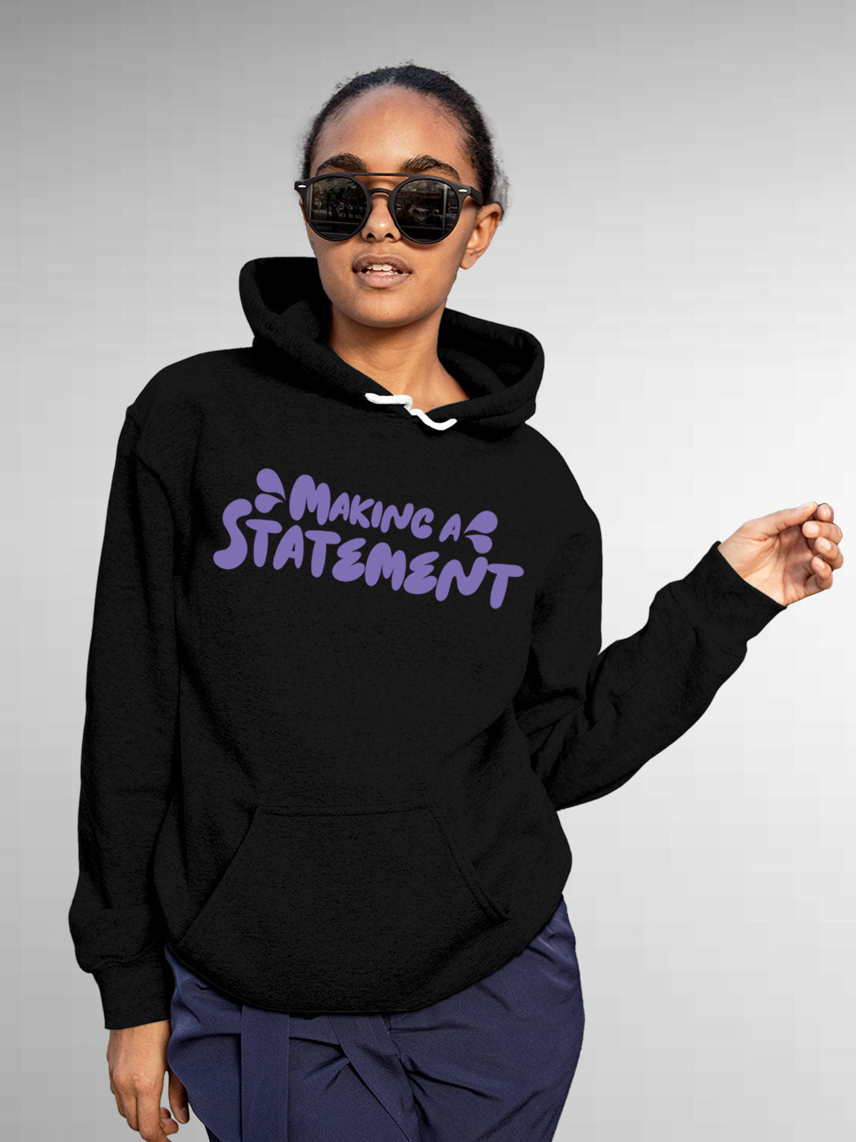 Model wearing Women's Black Hoodie Sweatshirt with 'Making A Statement' design, offering effortless style and premium comfort