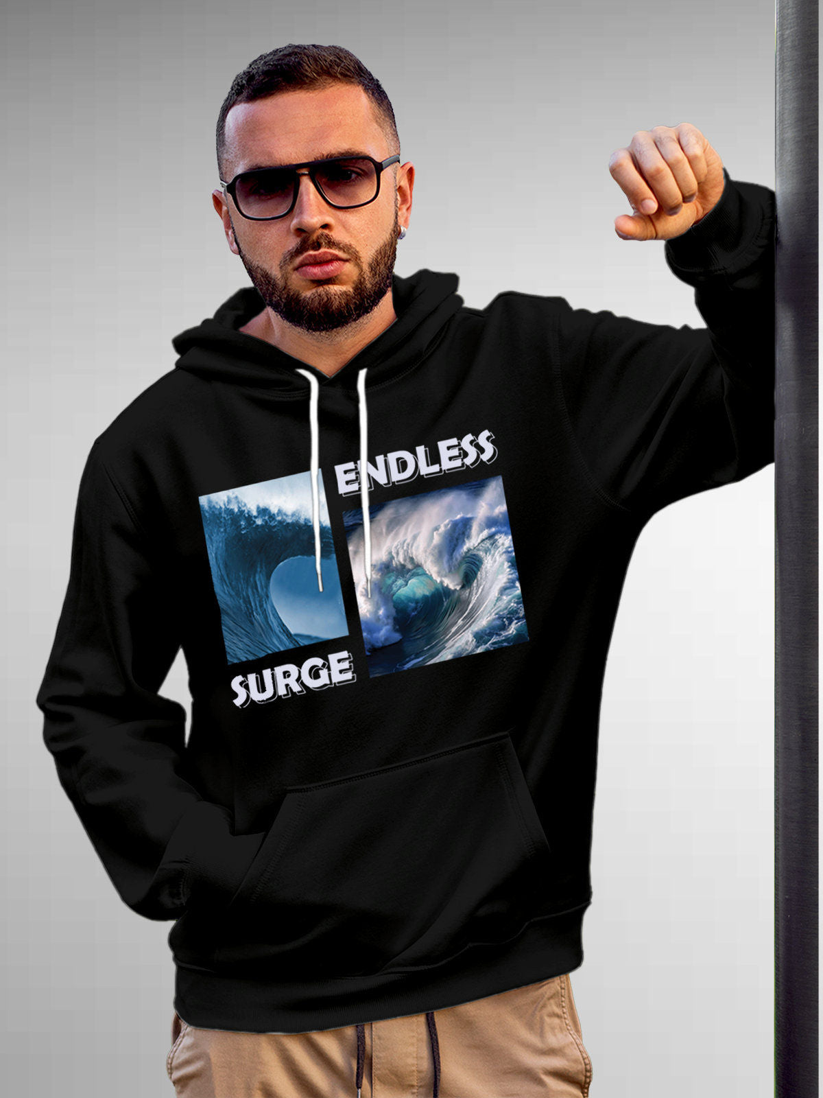 Model wearing Men's Black Hoodie Sweatshirt with 'Endless Surge' design, offering effortless style and premium comfort