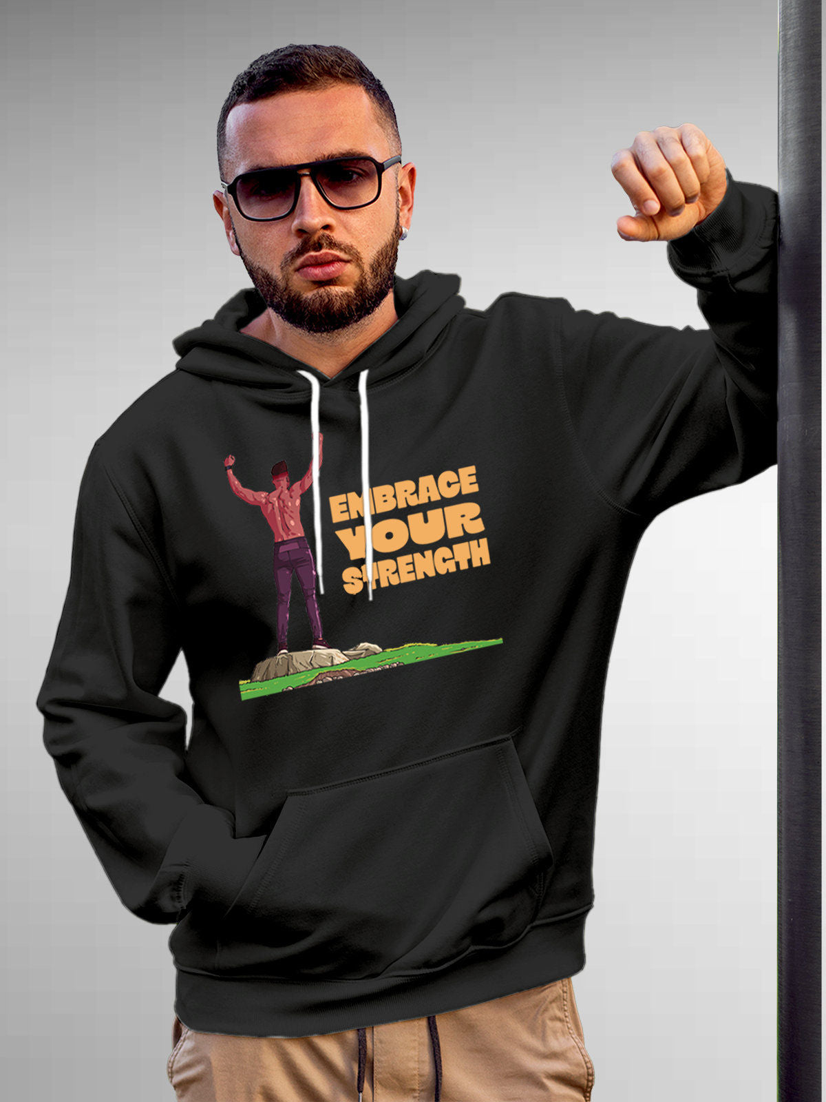Model wearing Men's Dark Grey Hoodie Sweatshirt with 'Embrace Your Strength' design, offering effortless style and premium comfort