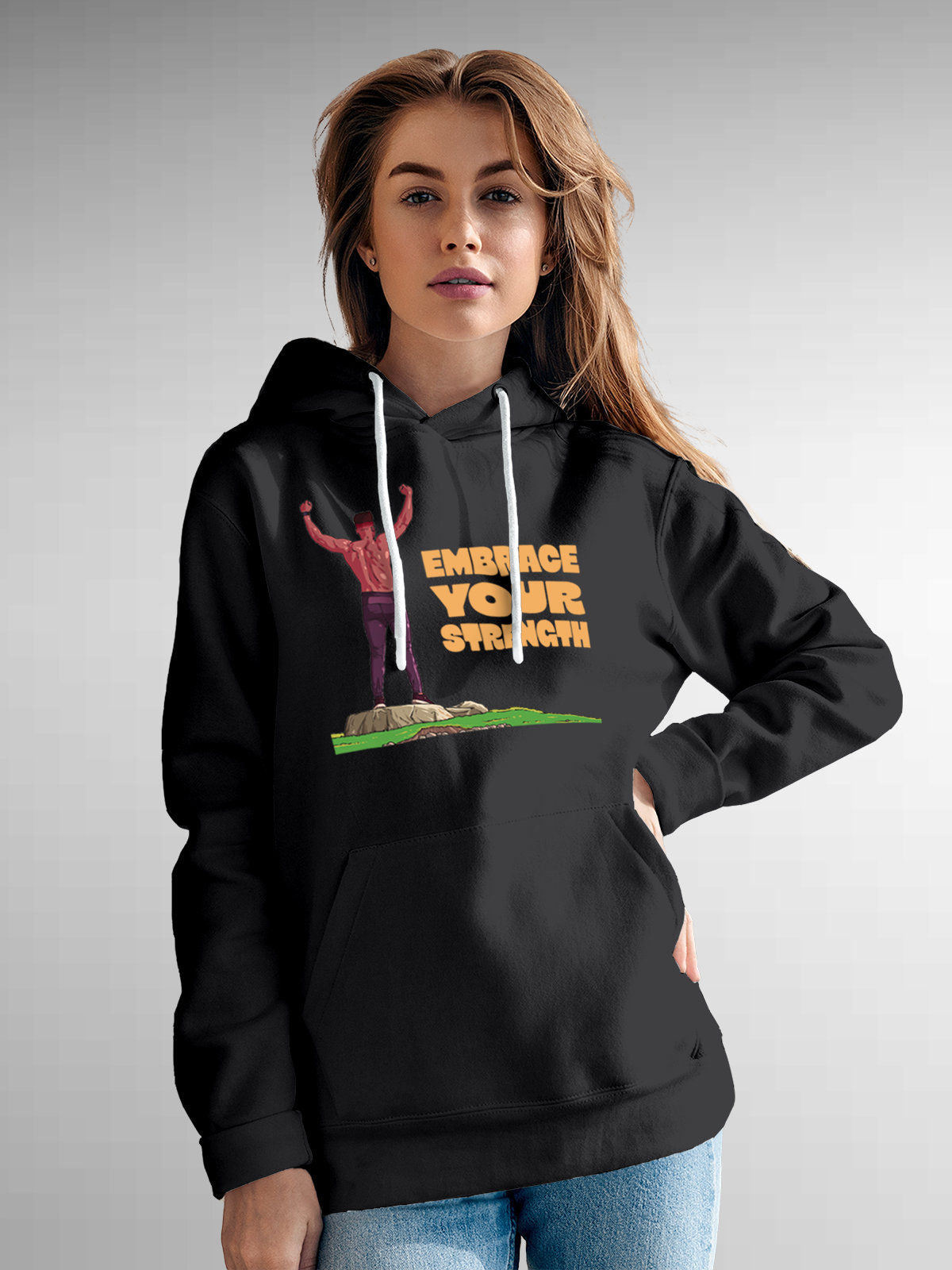 Model wearing Women's Dark Grey Hoodie Sweatshirt with 'Embrace Your Strength' design, offering effortless style and premium comfort