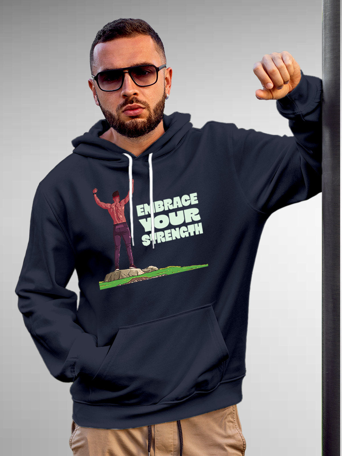 Model wearing Men's Navy Blue Hoodie Sweatshirt with 'Embrace Your Strength' design, offering effortless style and premium comfort
