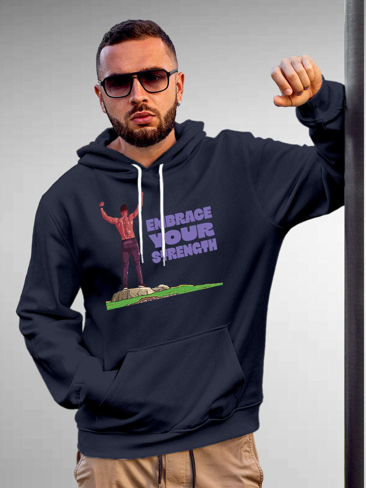 Model wearing Men's Navy Blue Hoodie Sweatshirt with 'Embrace Your Strength' design, offering effortless style and premium comfort