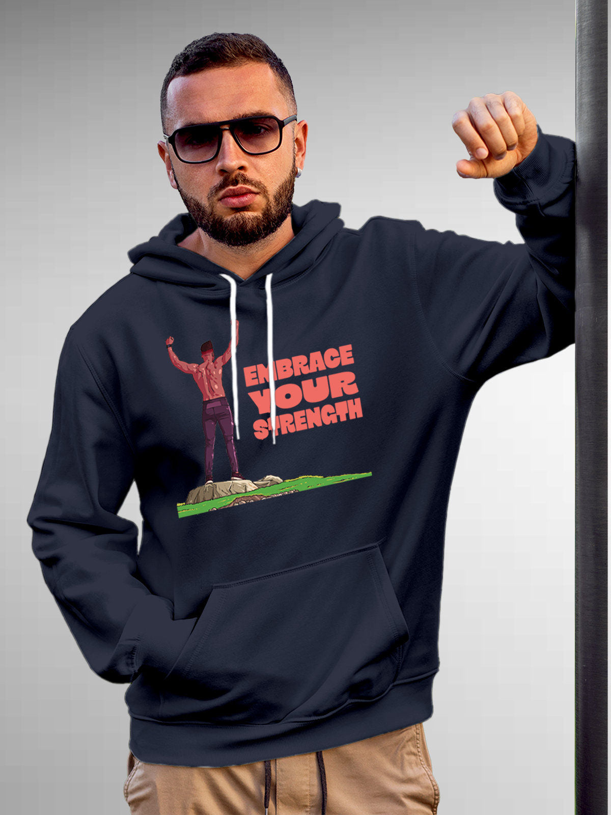Model wearing Men's Navy Blue Hoodie Sweatshirt with 'Embrace Your Strength' design, offering effortless style and premium comfort