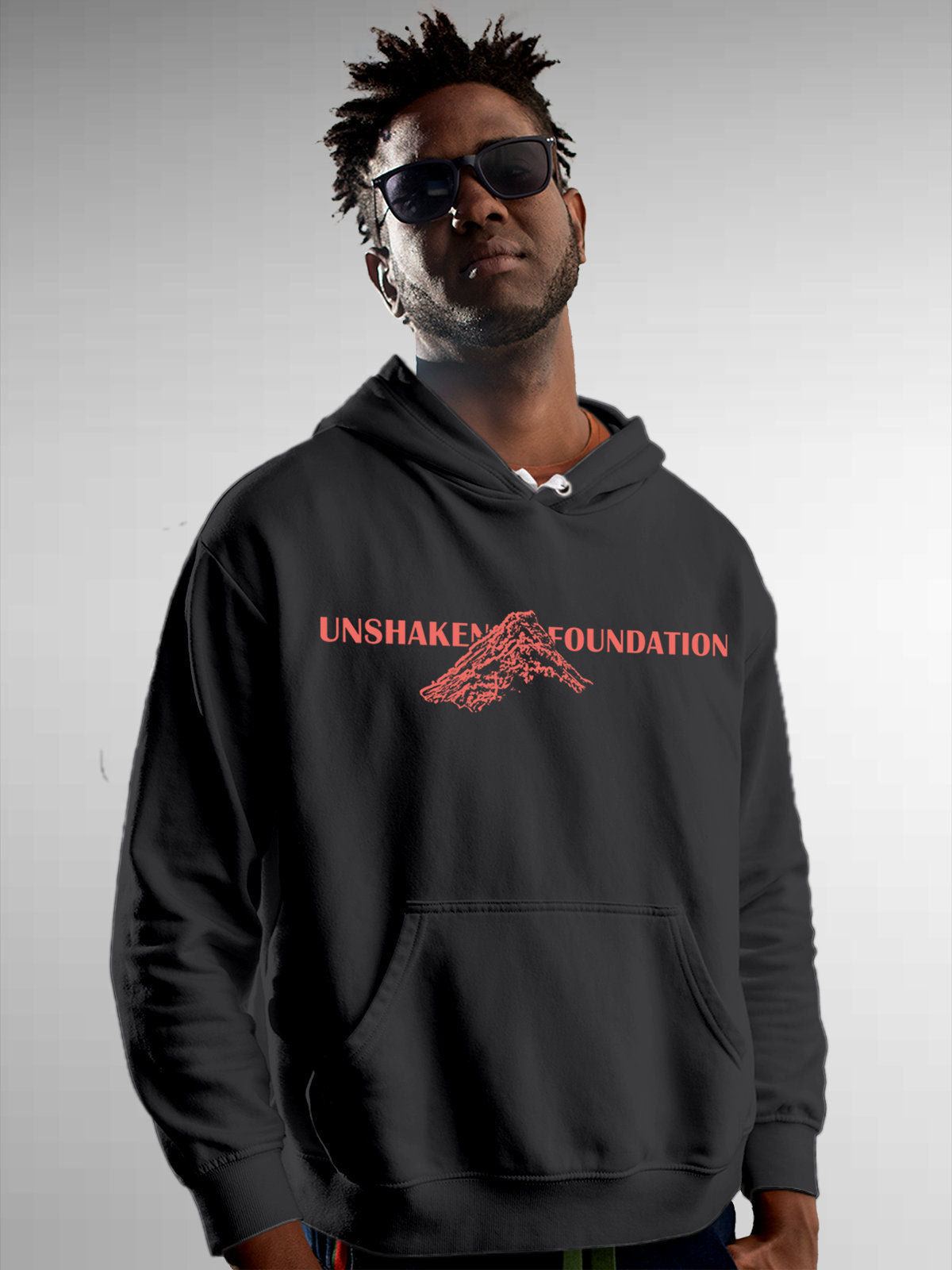 Model wearing Men's Dark Grey Hoodie Sweatshirt with 'Unshaken Foundation' design, offering effortless style and premium comfort
