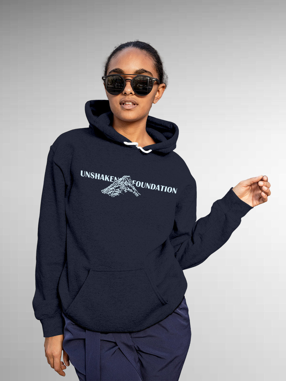 Model wearing Women's Navy Blue Hoodie Sweatshirt with 'Unshaken Foundation' design, offering effortless style and premium comfort