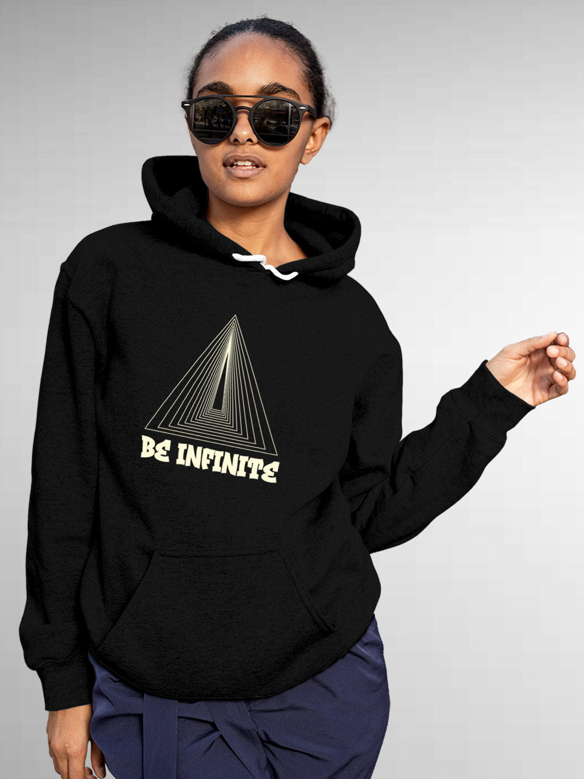 Model wearing Women's Black Hoodie Sweatshirt with 'Be Infinite' design, offering effortless style and premium comfort