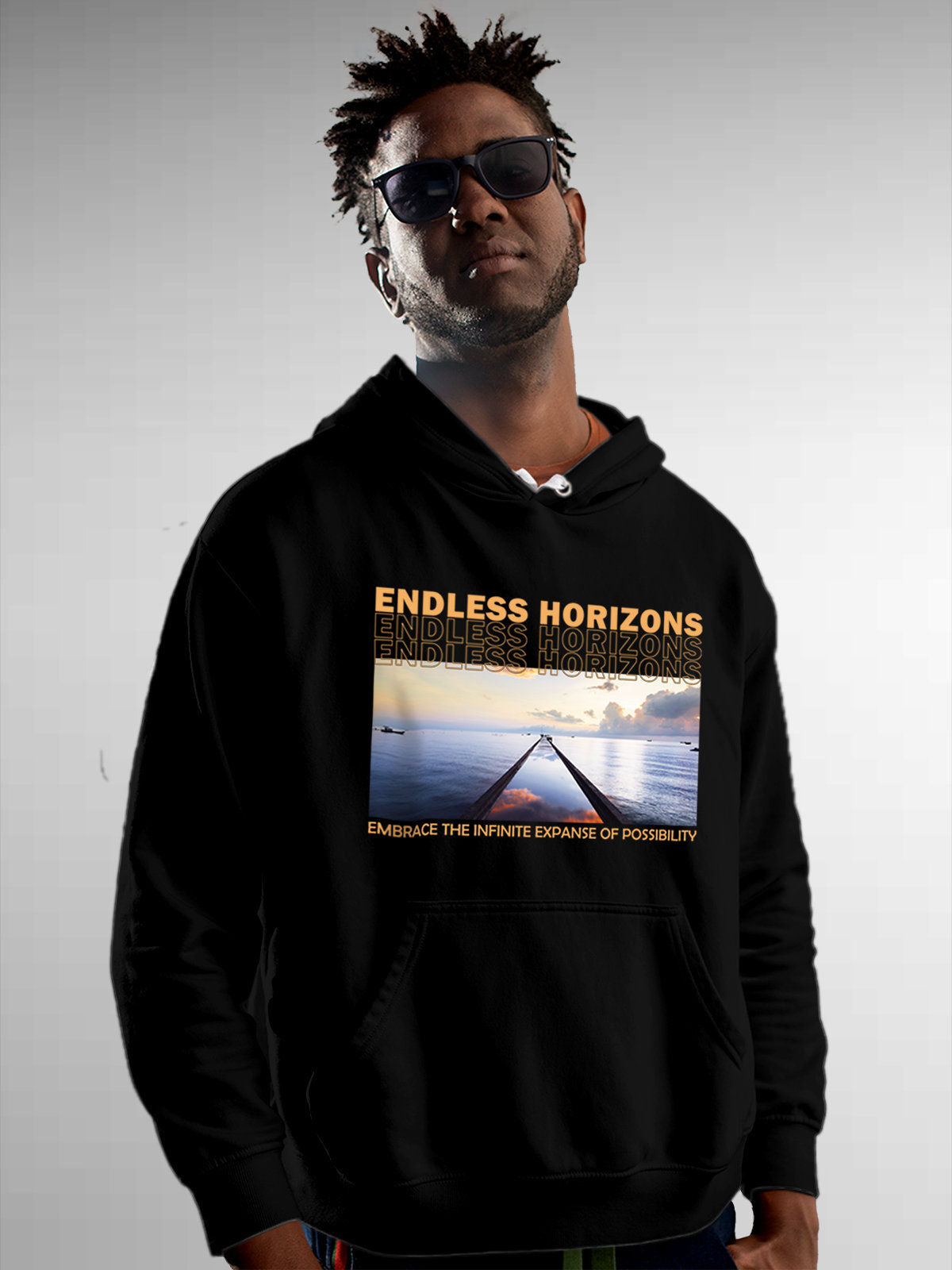 Model wearing Men's Black Hoodie Sweatshirt with 'Endless Horizons' design, offering effortless style and premium comfort