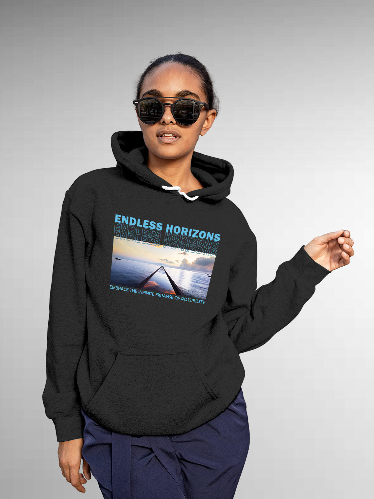 Model wearing Women's Dark Grey Hoodie Sweatshirt with 'Endless Horizons' design, offering effortless style and premium comfort