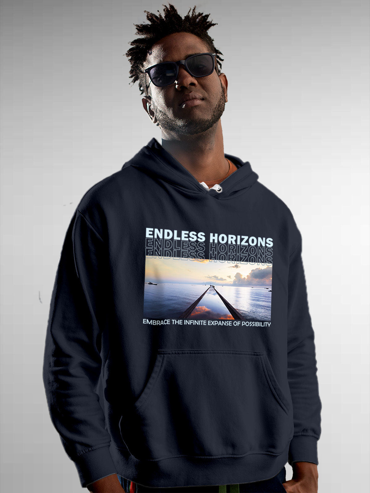Model wearing Men's Navy Blue Hoodie Sweatshirt with 'Endless Horizons' design, offering effortless style and premium comfort