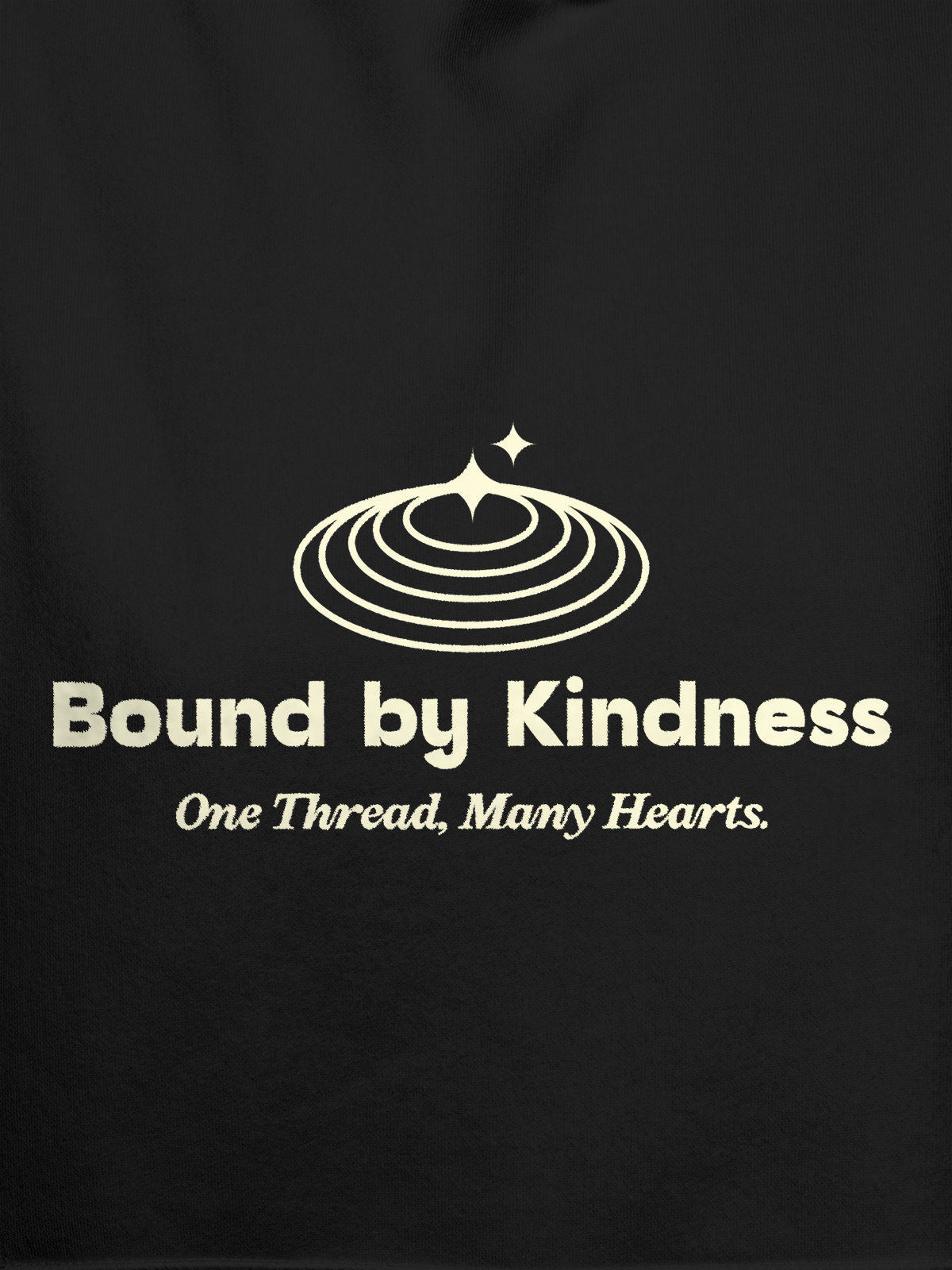 Close up of 'Bound By Kindness' design on Women's Dark Grey Hoodie Sweatshirt, highlighting intricate details and vibrant print.