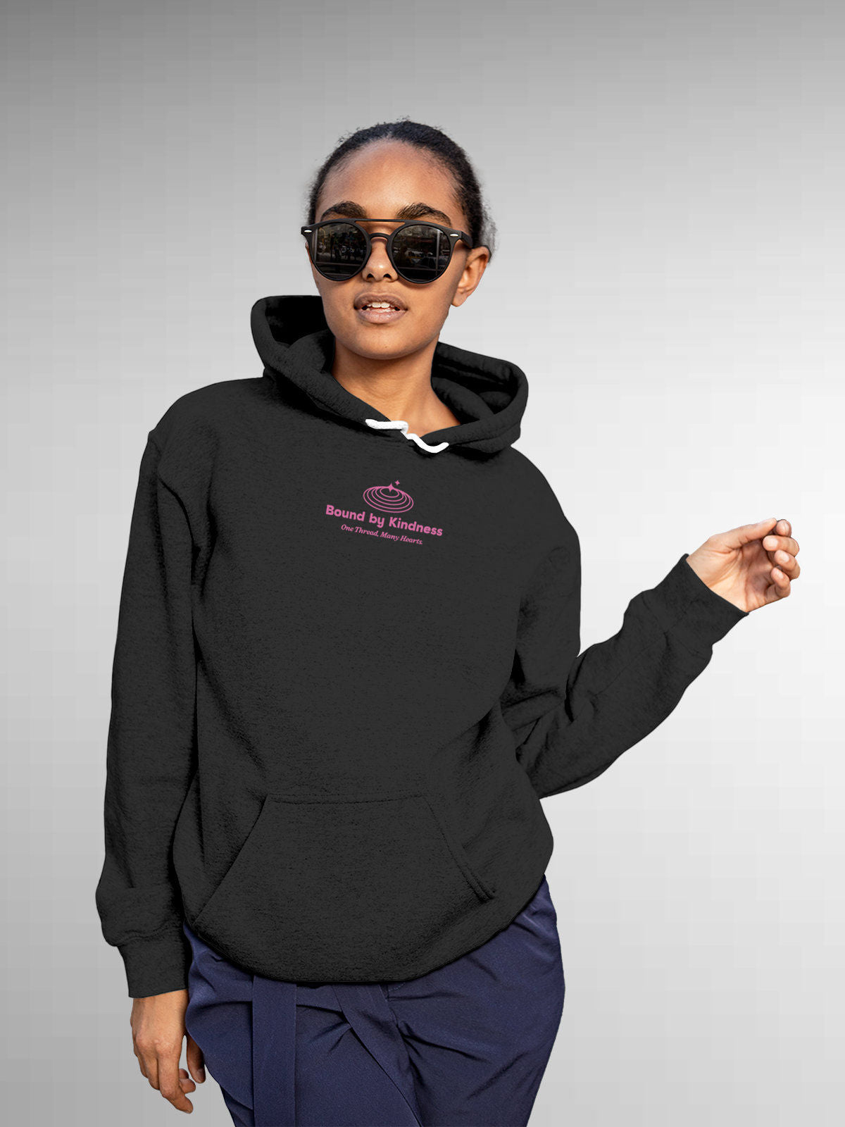 Model wearing Women's Dark Grey Hoodie Sweatshirt with 'Bound By Kindness' design, offering effortless style and premium comfort