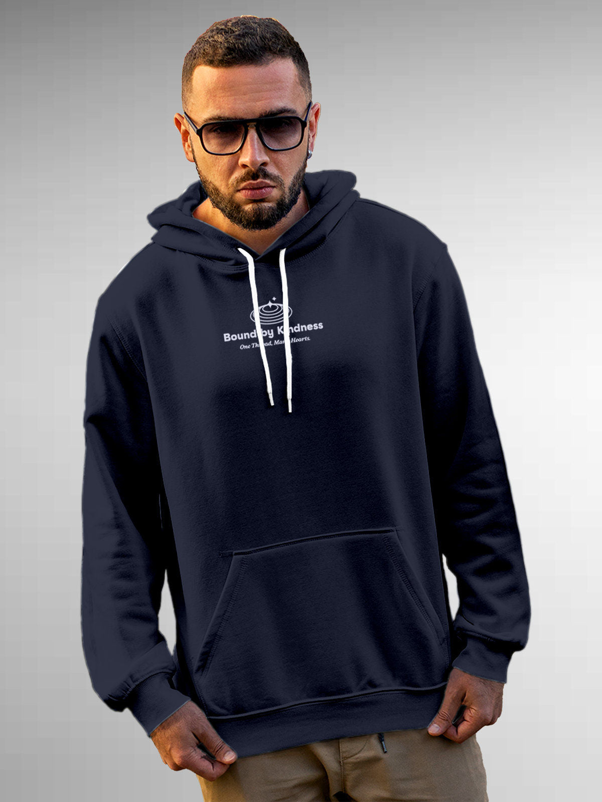Model wearing Men's Navy Blue Hoodie Sweatshirt with 'Bound By Kindness' design, offering effortless style and premium comfort