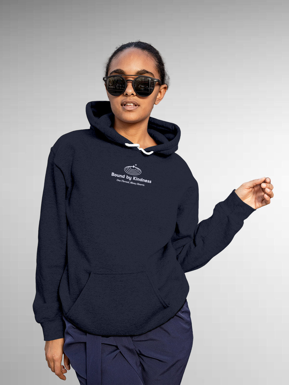 Model wearing Women's Navy Blue Hoodie Sweatshirt with 'Bound By Kindness' design, offering effortless style and premium comfort