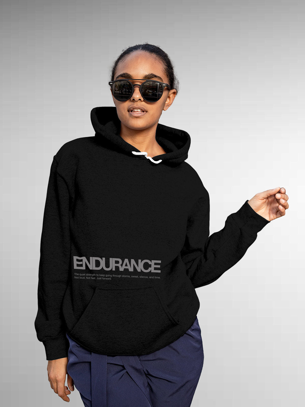 Model wearing Women's Black Hoodie Sweatshirt with 'Endurance' design, offering effortless style and premium comfort