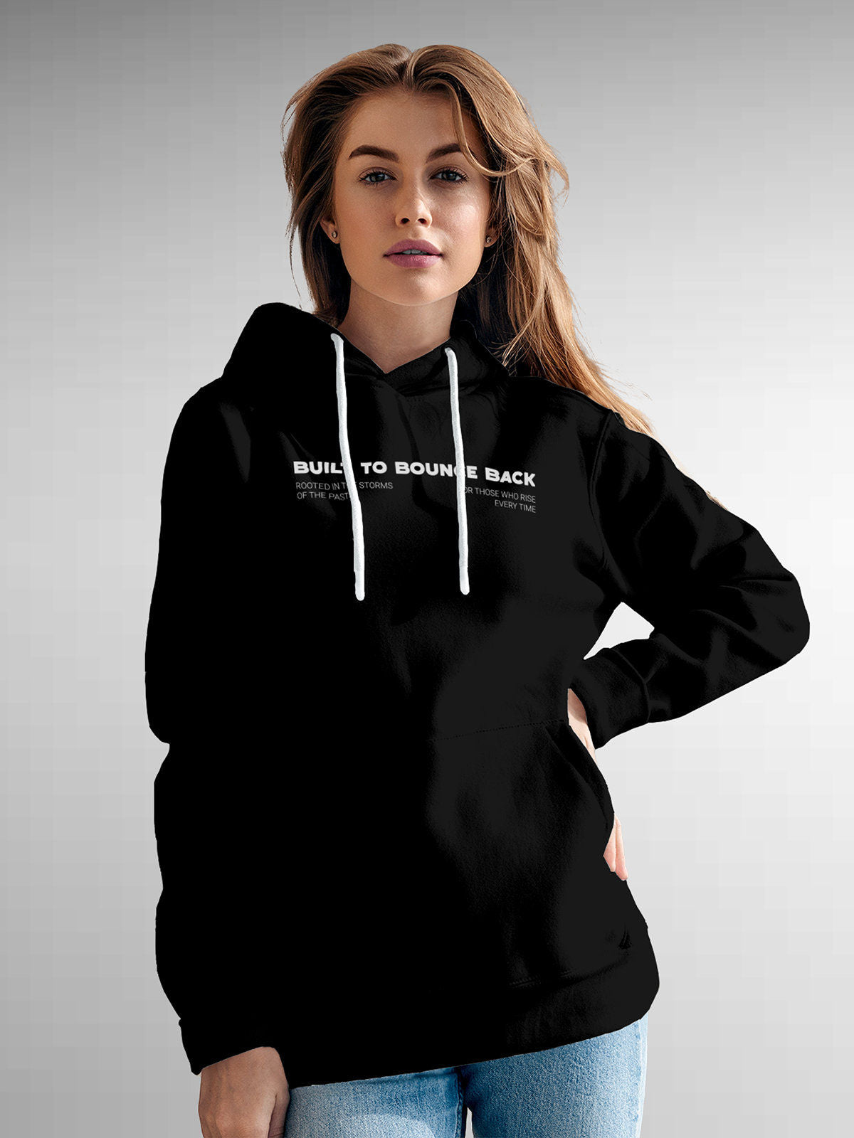 Model wearing Women's Black Hoodie Sweatshirt with 'Built To Bounce Back' design, offering effortless style and premium comfort