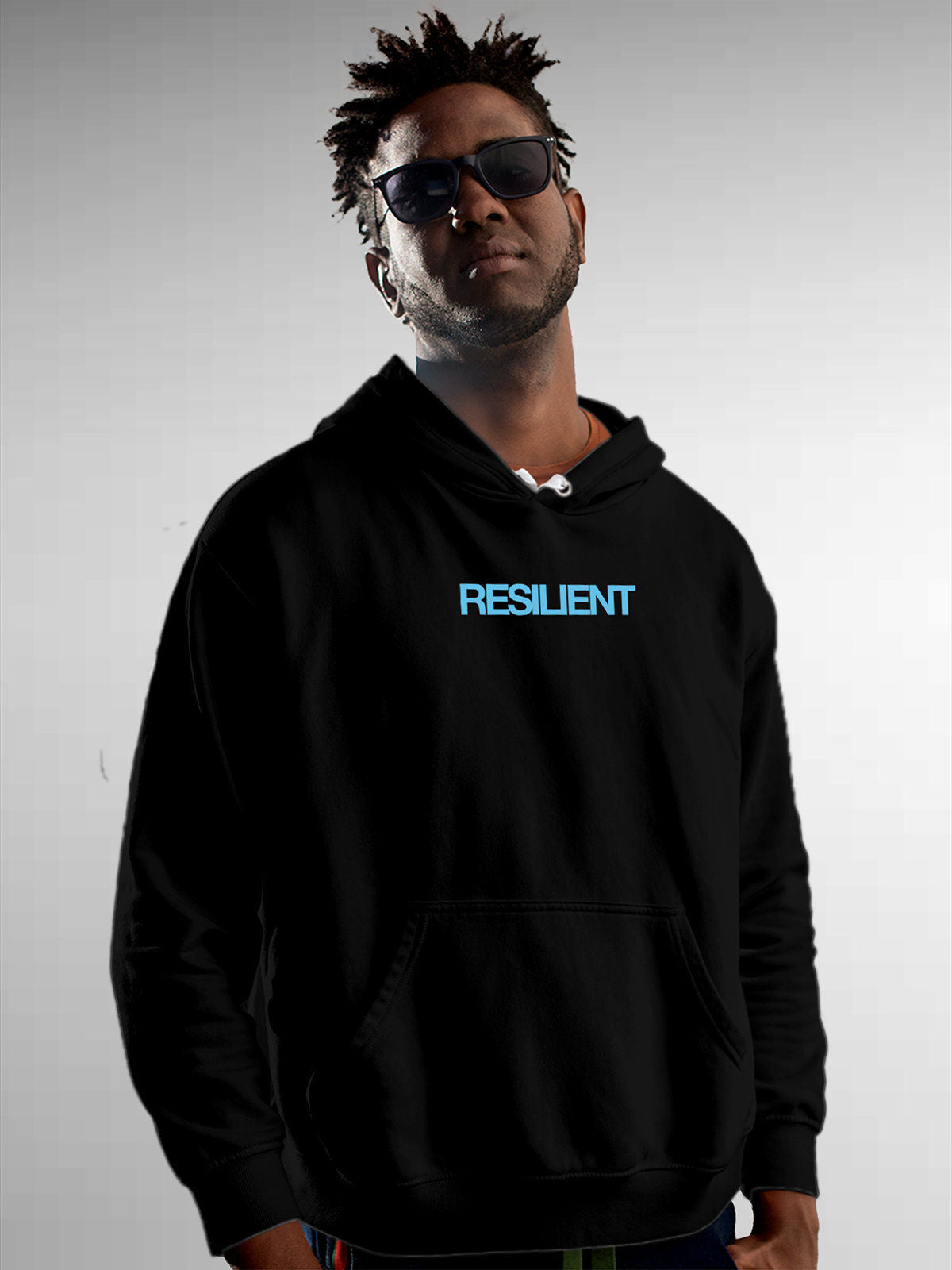 Model wearing Men's Black Hoodie Sweatshirt with 'Resilient' design, offering effortless style and premium comfort