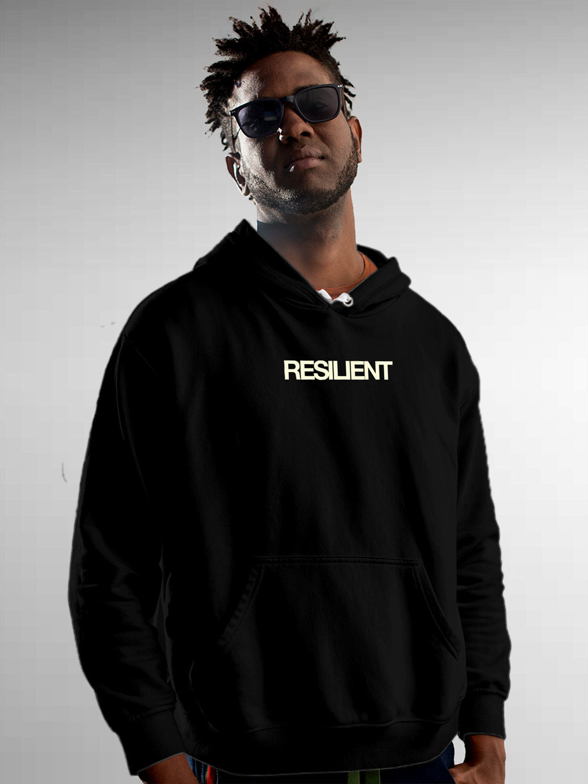 Model wearing Men's Black Hoodie Sweatshirt with 'Resilient' design, offering effortless style and premium comfort