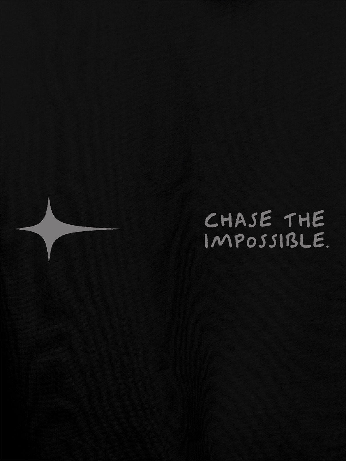 Close up of 'Chase The Impossible' design on Women's Black Hoodie Sweatshirt, highlighting intricate details and vibrant print.