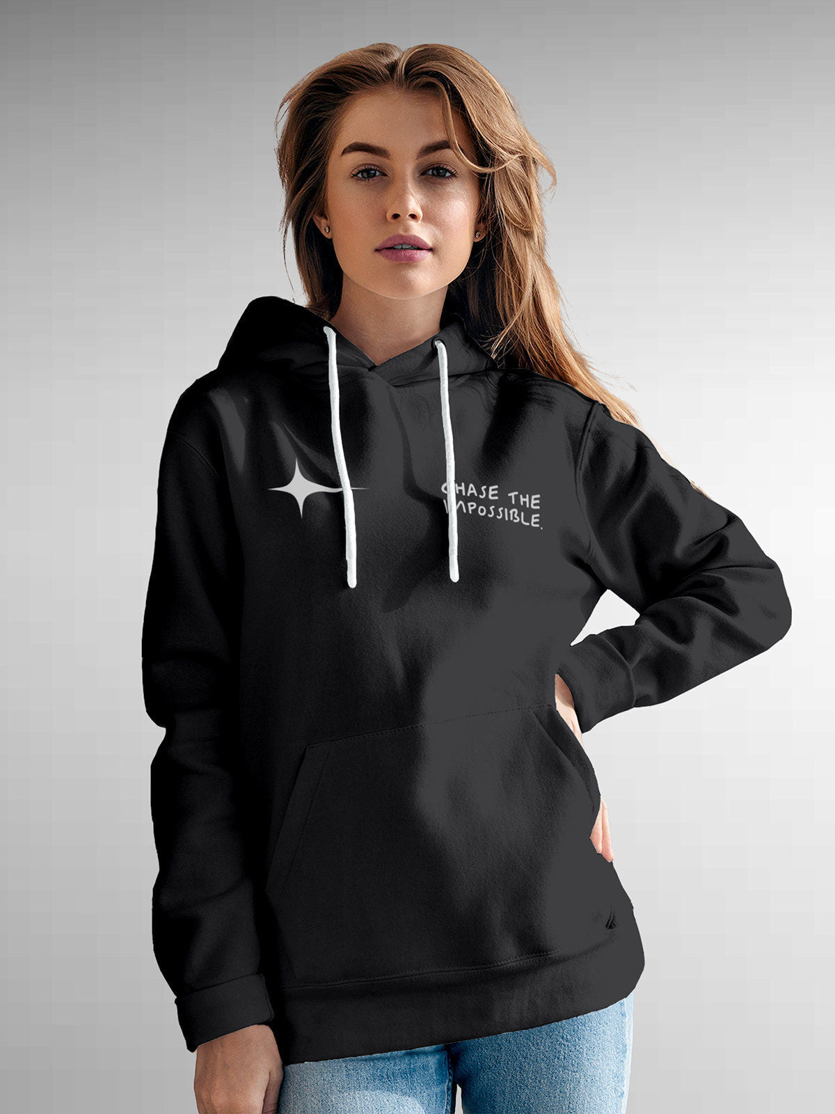 Model wearing Women's Dark Grey Hoodie Sweatshirt with 'Chase The Impossible' design, offering effortless style and premium comfort