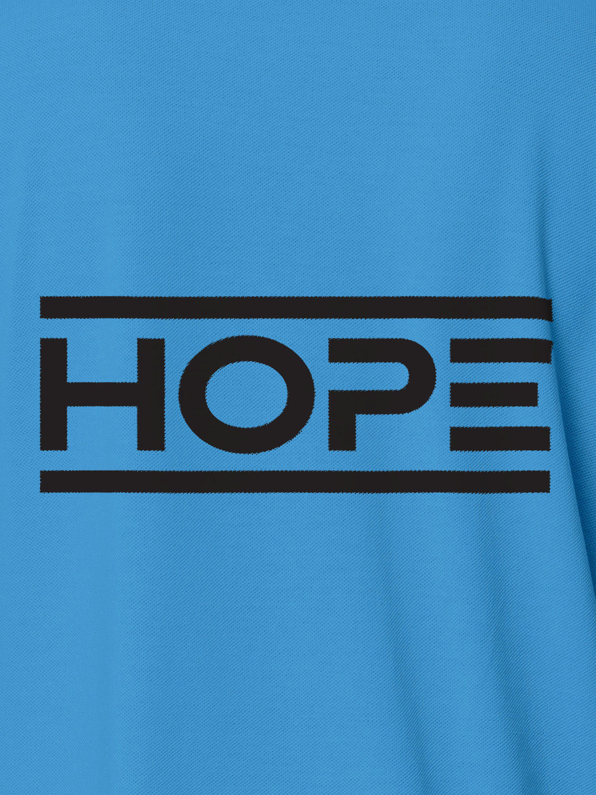 Close up of 'Hope' design on Women's Blue Polo T-shirt, highlighting intricate details and vibrant print.