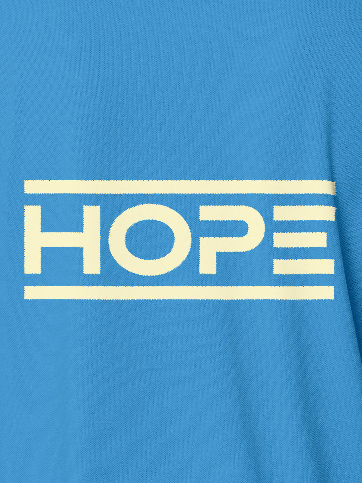 Close up of 'Hope' design on Women's Blue Polo T-shirt, highlighting intricate details and vibrant print.