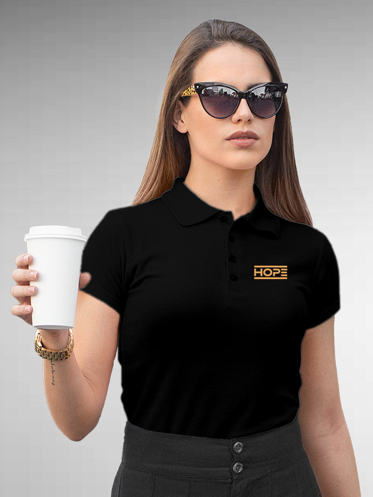 Model wearing Women's Black Polo T-shirt with 'Hope' design, offering effortless style and premium comfort