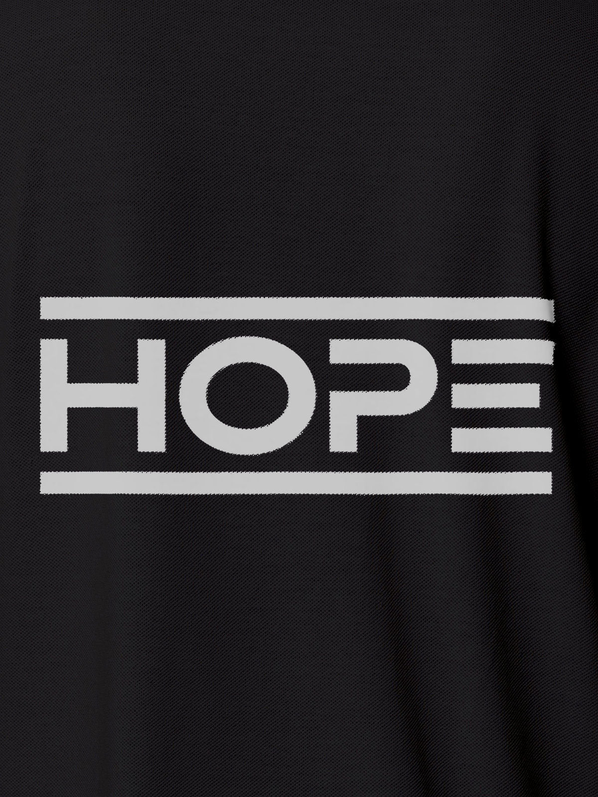Close up of 'Hope' design on Women's Dark Grey Polo T-shirt, highlighting intricate details and vibrant print.