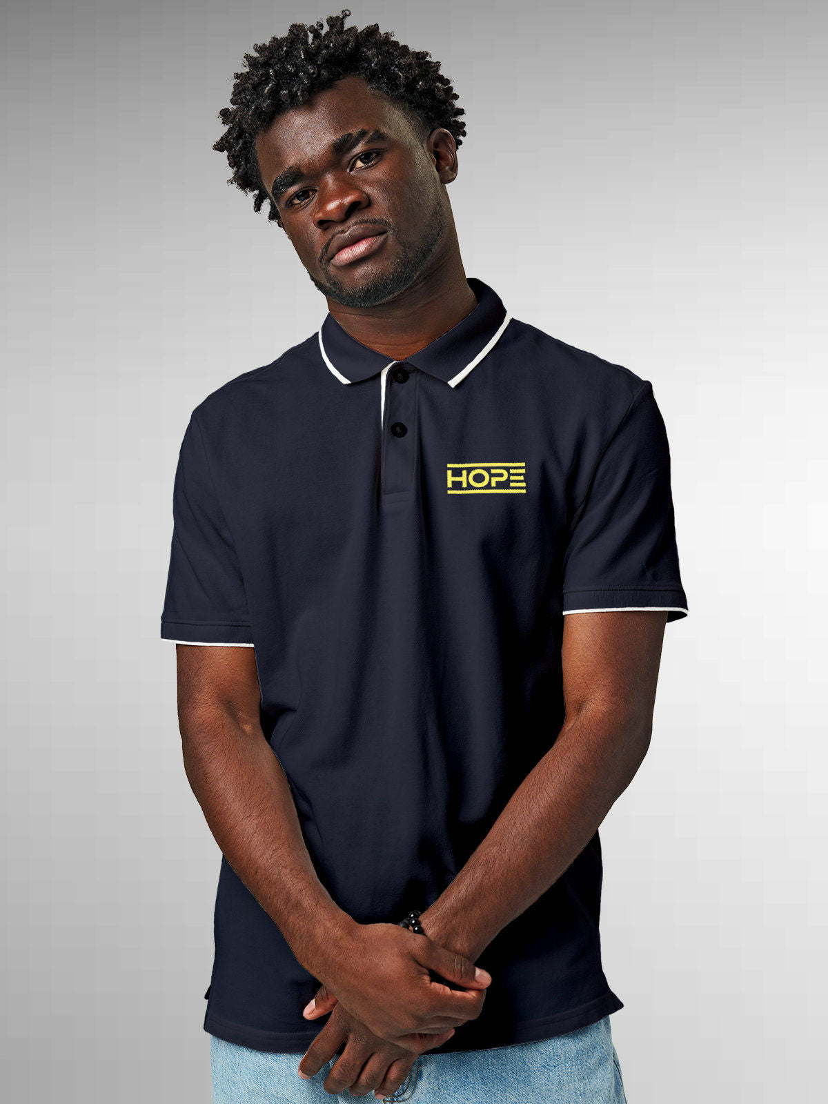 Model wearing Men's Navy Blue Polo T-shirt with 'Hope' design, offering effortless style and premium comfort
