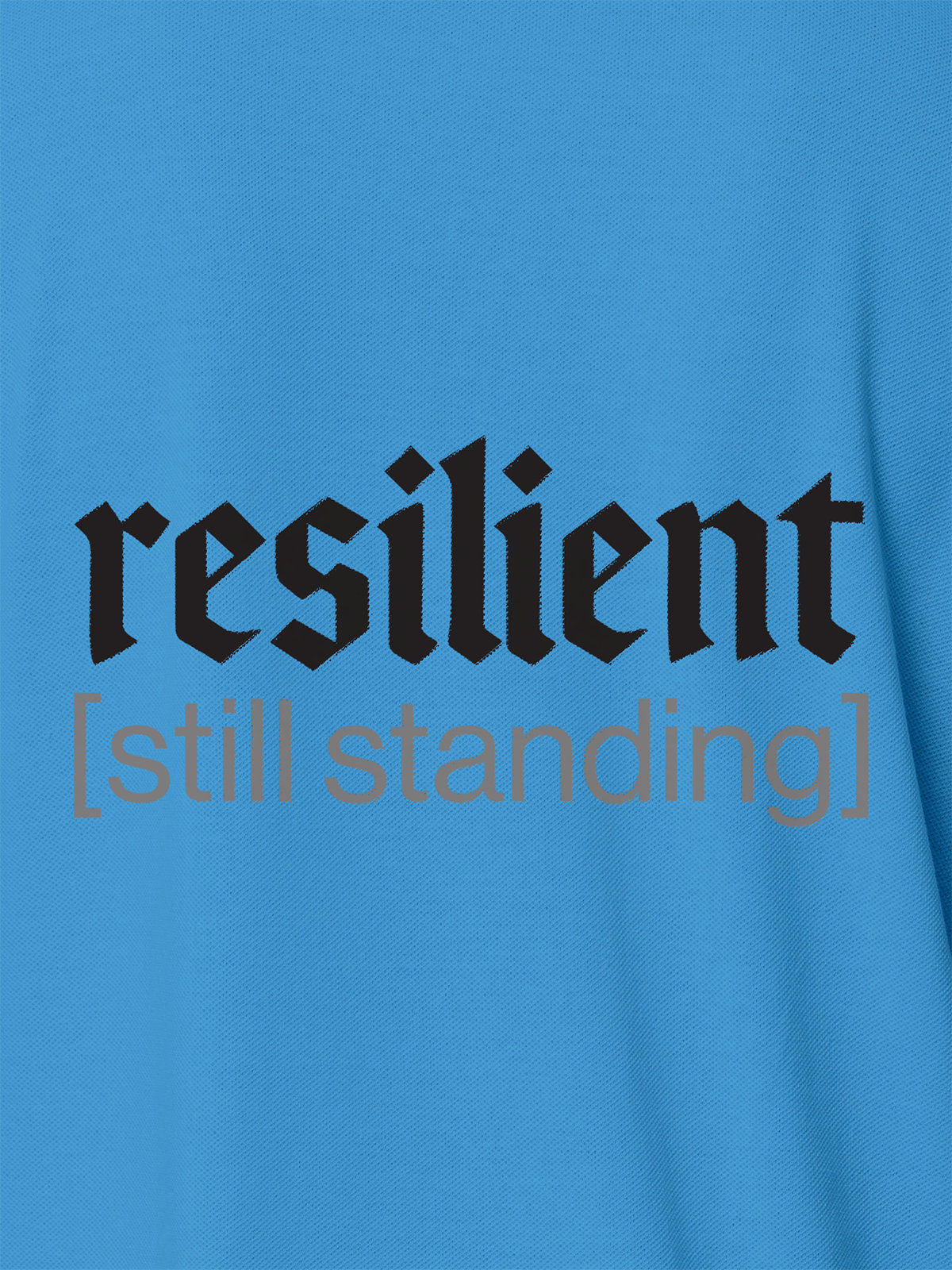 Close up of 'Resilient' design on Men's Blue Polo T-shirt, highlighting intricate details and vibrant print.