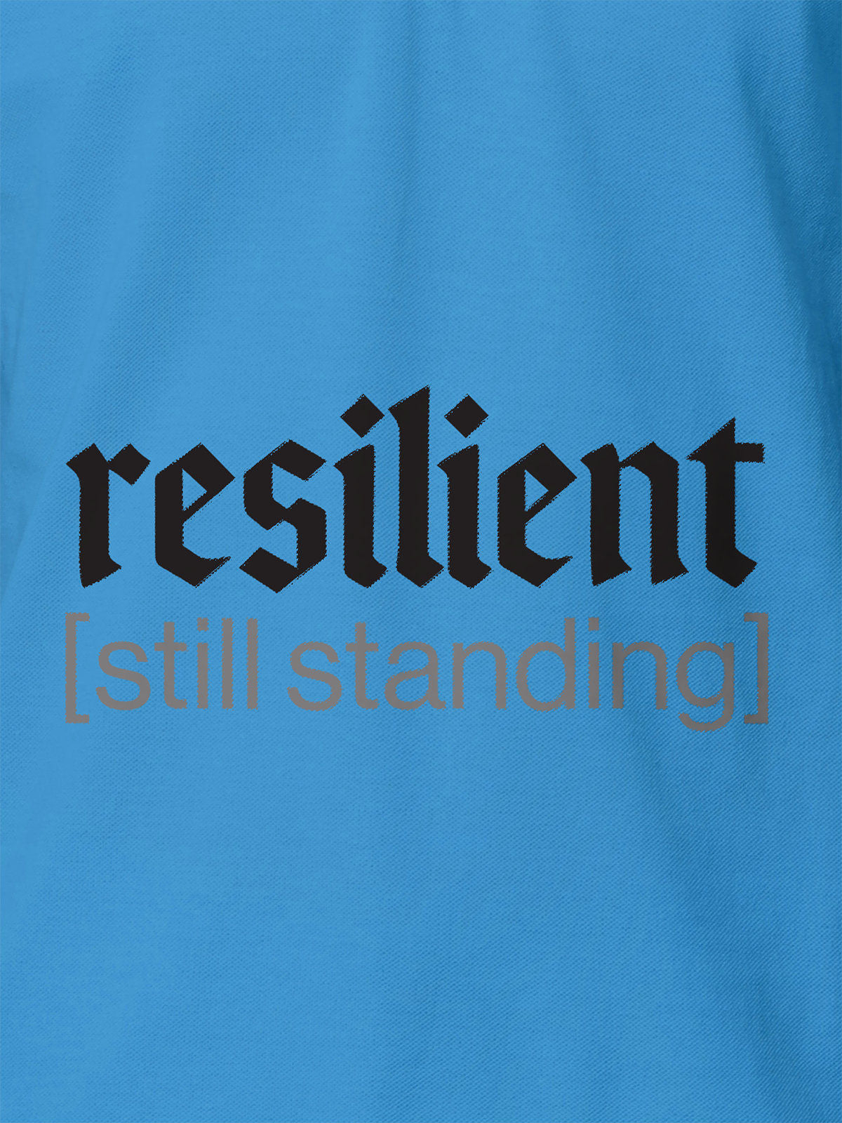 Close up of 'Resilient' design on Women's Blue Polo T-shirt, highlighting intricate details and vibrant print.
